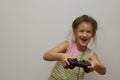 Little girl playing with playstation joystick Royalty Free Stock Photo