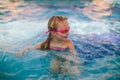 Little girl playing on the pool Royalty Free Stock Photo