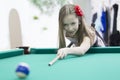 Little girl playing pool Royalty Free Stock Photo