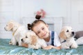 Little girl playing with Puppies Retriever Royalty Free Stock Photo