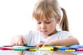 Little girl playing with puzzle pieces. Royalty Free Stock Photo