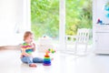 Little girl playing with a pyramid Royalty Free Stock Photo