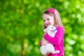 Little girl playing with rabbit Royalty Free Stock Photo