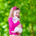 Little girl playing with rabbit Royalty Free Stock Photo