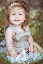 Little girl playing with rabbit in the village. Outdoor. Summer portrait. Royalty Free Stock Photo