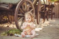 Little girl playing with rabbit in the village. Outdoor. Summer portrait. Royalty Free Stock Photo