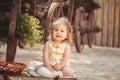 Little girl playing with rabbit in the village. Outdoor. Summer portrait. Royalty Free Stock Photo