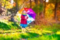 Little girl playing in the rain in autumn Royalty Free Stock Photo