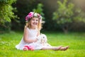 Little girl playing with real rabbit Royalty Free Stock Photo