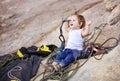 Little girl playing with rock climbing gear Royalty Free Stock Photo