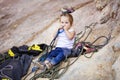 Little girl playing with rock climbing gear Royalty Free Stock Photo