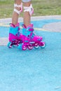 Little girl playing with roller skates Royalty Free Stock Photo