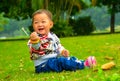 The little girl playing s.viridis alone(Asia, China, Chinese) Royalty Free Stock Photo