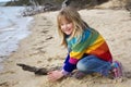 Little girl playing in sand