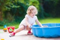 Little girl playing with sand Royalty Free Stock Photo