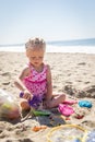 Little Girl Playing With Sand Toys at the Beach Royalty Free Stock Photo