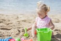 Little girl playing sand toys at the beach Royalty Free Stock Photo