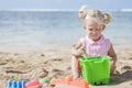 Little girl playing sand toys at the beach Royalty Free Stock Photo