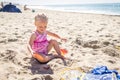 Little Girl Playing With Sand Toys at the Beach Royalty Free Stock Photo