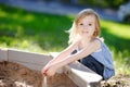 Little girl playing in a sandbox Royalty Free Stock Photo