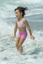 A little girl playing in the sea Royalty Free Stock Photo