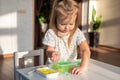 Little girl playing with sensory water beads, hydrogel balls. Sensory development and experiences, Montessori, themed