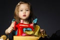 Little girl is playing with sewing machine Royalty Free Stock Photo