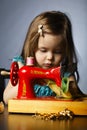 Little girl is playing with sewing machine Royalty Free Stock Photo