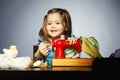 Little girl is playing with sewing machine Royalty Free Stock Photo