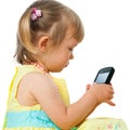 Little girl playing with smartphone. Royalty Free Stock Photo