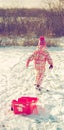 Little girl playing in the snow Royalty Free Stock Photo