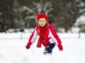 Little girl playing with snow while snowflurry Royalty Free Stock Photo