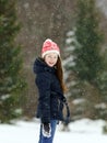 Little girl playing with snow while snowflurry Royalty Free Stock Photo