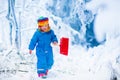 Little girl playing with snow in winter Royalty Free Stock Photo