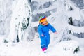Little girl playing with snow in winter Royalty Free Stock Photo