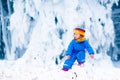 Little girl playing with snow in winter Royalty Free Stock Photo