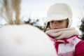 Little girl playing with snowman Royalty Free Stock Photo