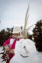 Little girl playing with snowman Royalty Free Stock Photo