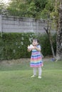 Little girl playing with soap bubbles in the park Royalty Free Stock Photo