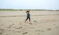 Little girl playing soccer on the beach Royalty Free Stock Photo