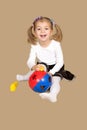 The little girl playing with a sphere puzzle Royalty Free Stock Photo