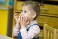 Little girl playing and studying on lessons in kindergarden Royalty Free Stock Photo