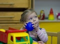 Little girl playing and studying on lessons in kindergarden Royalty Free Stock Photo