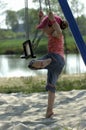 Little girl playing on a swing Royalty Free Stock Photo