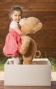 Little girl playing with teddy bear Royalty Free Stock Photo