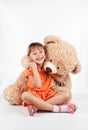 Little girl playing with a teddy bear Royalty Free Stock Photo