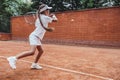 Little Girl playing tennis on the court Royalty Free Stock Photo