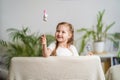 Little girl is playing theater. Finger puppets dressed on sticks held by a child