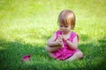 Little girl playing with toes Royalty Free Stock Photo