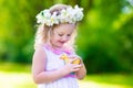 Little girl playing with a toy duck Royalty Free Stock Photo